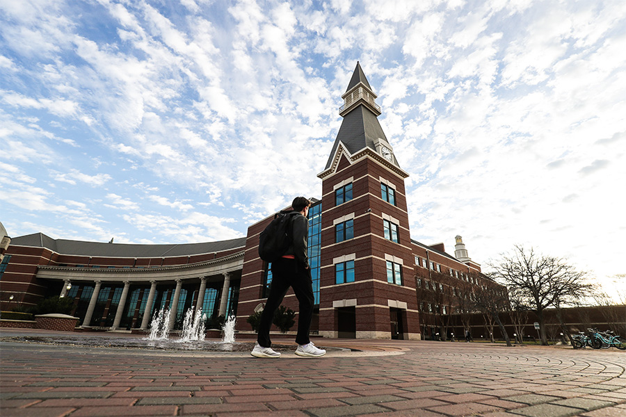 student walking in front of Baylor science building